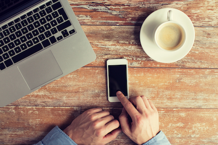 mobile phone, computer and coffee cup